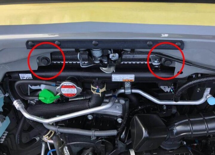 Clips on the left and right of the bonnet catch