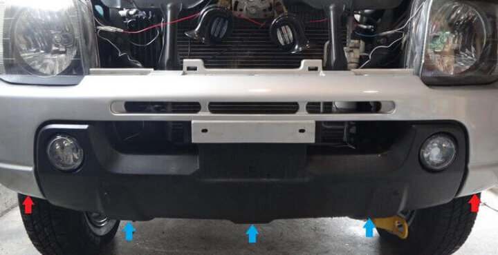 3 bolts on the underside of the bumper