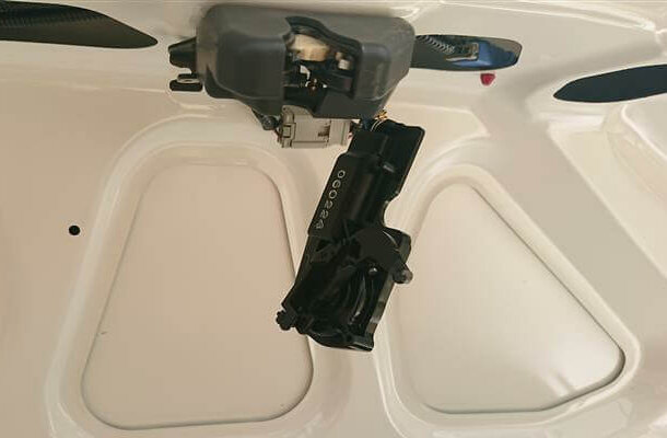Actuator attached to the trunk striker
