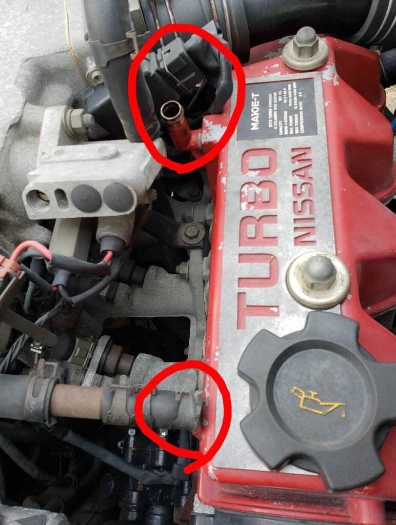 Remove hoses and connector.